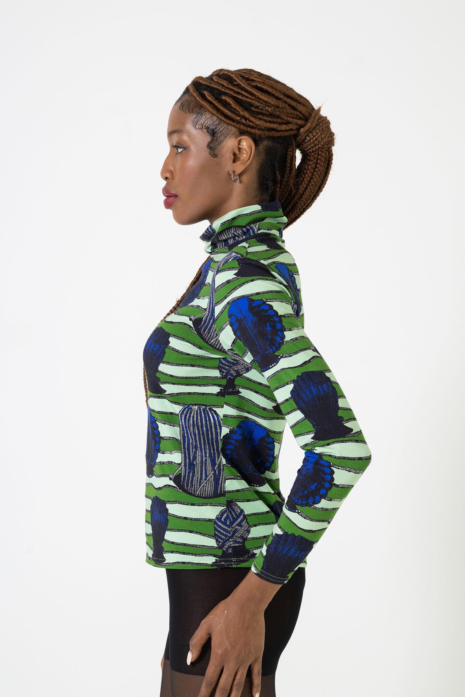 model wearing a women's fun stylish comfy African print turtleneck