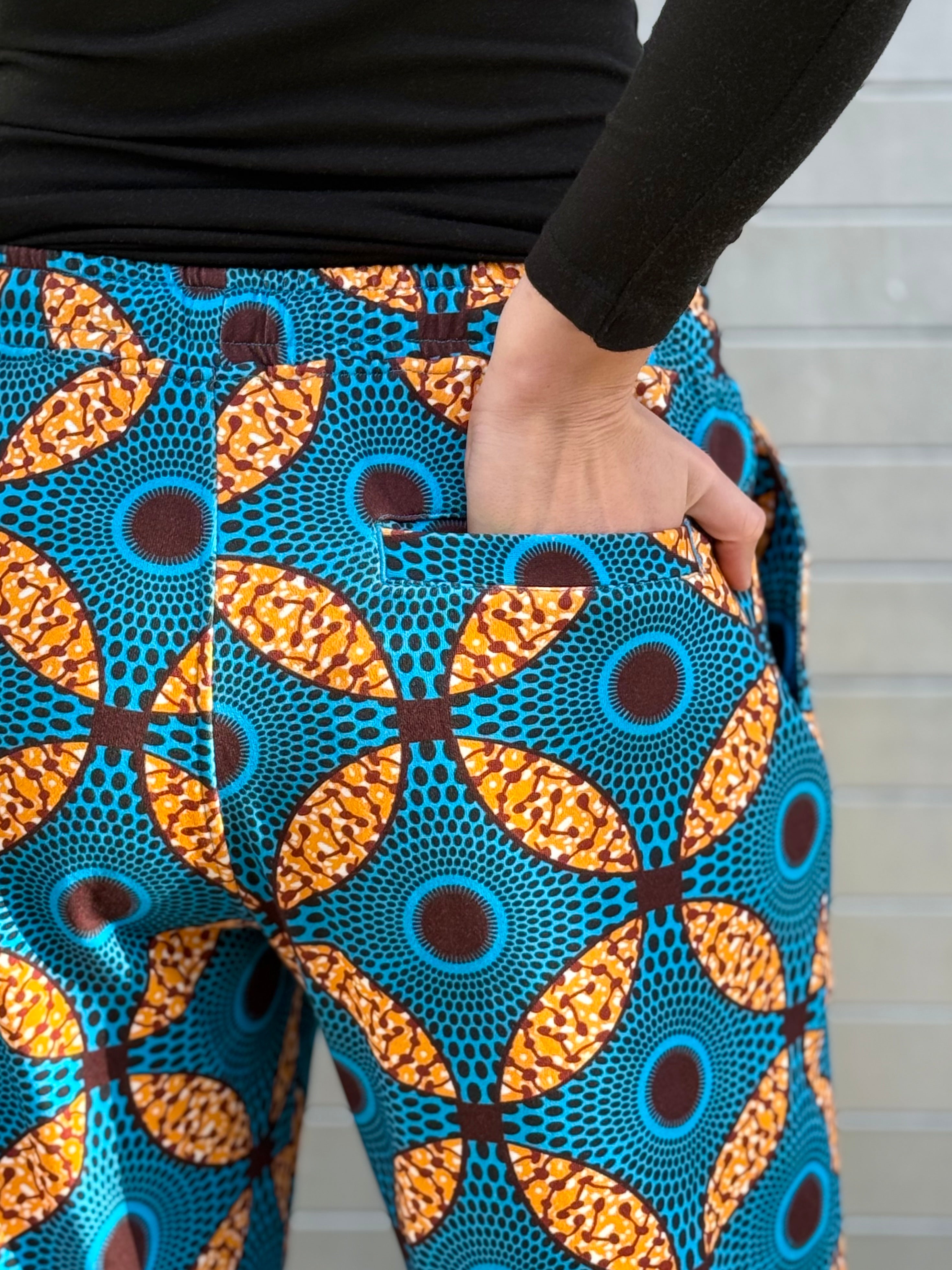Back pocket detail of the Ìmọ̀lẹ̀ Blue Sweat Pants by Lola Faturoti Loves, showcasing intricate patterns printed with eco-friendly inks. Ethically produced in small batches to empower women artisans and preserve craft heritage.