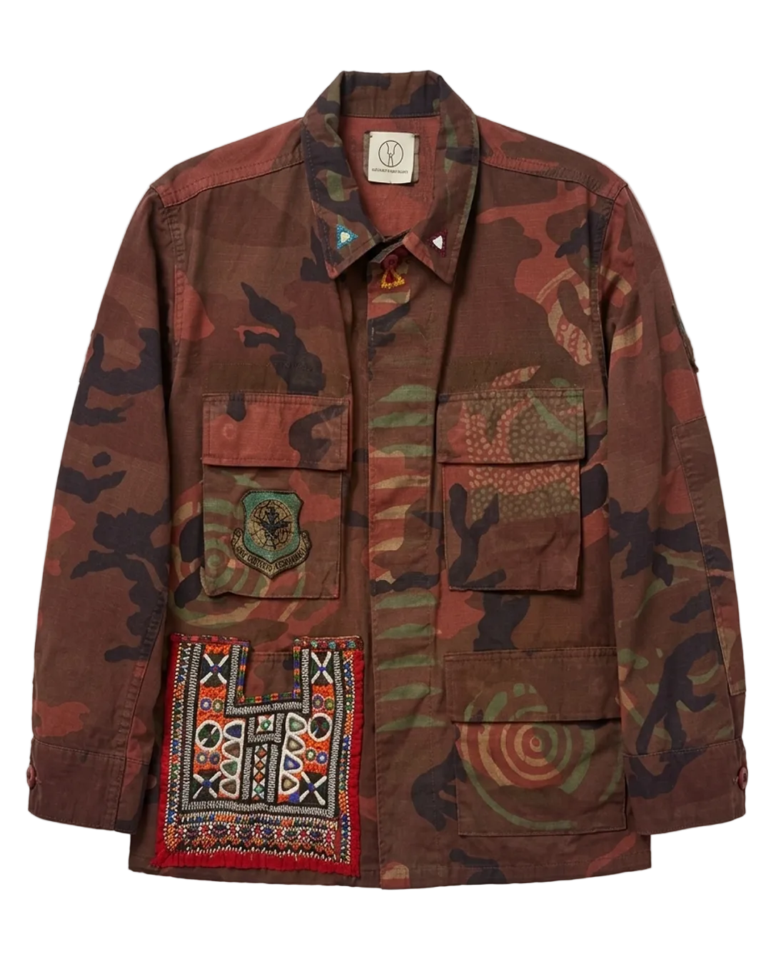 Exclusive reworked military jacket featuring earthy rust dye, subtle geometric patterning, and artisan mirror embroidery