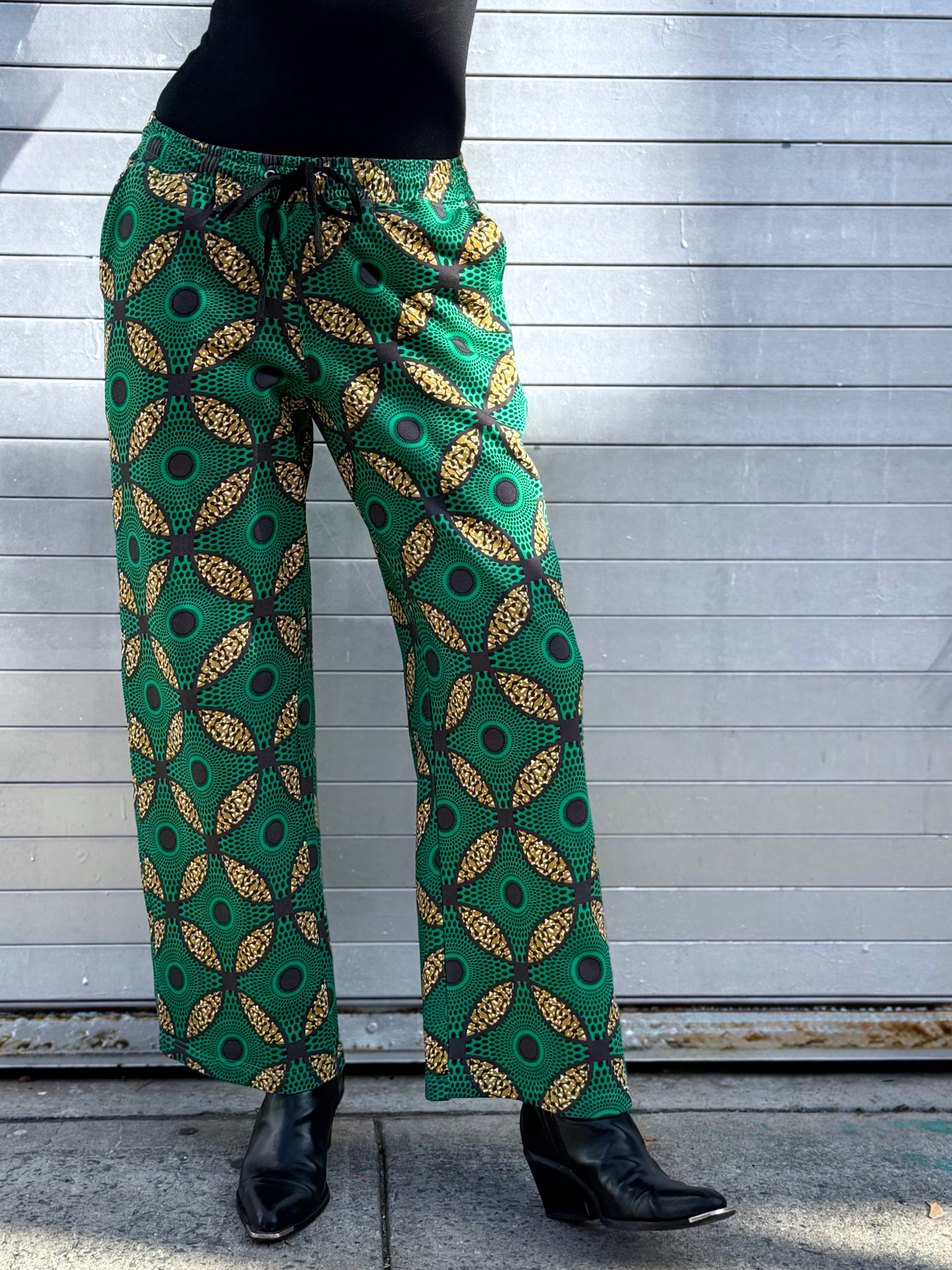 Shot of the Ìmọ̀lẹ̀ Green Sweat Pants, showcasing the artisan print and flattering silhouette. A limited-edition piece crafted in partnership with women artisans in India to support fair-wage craftsmanship.
