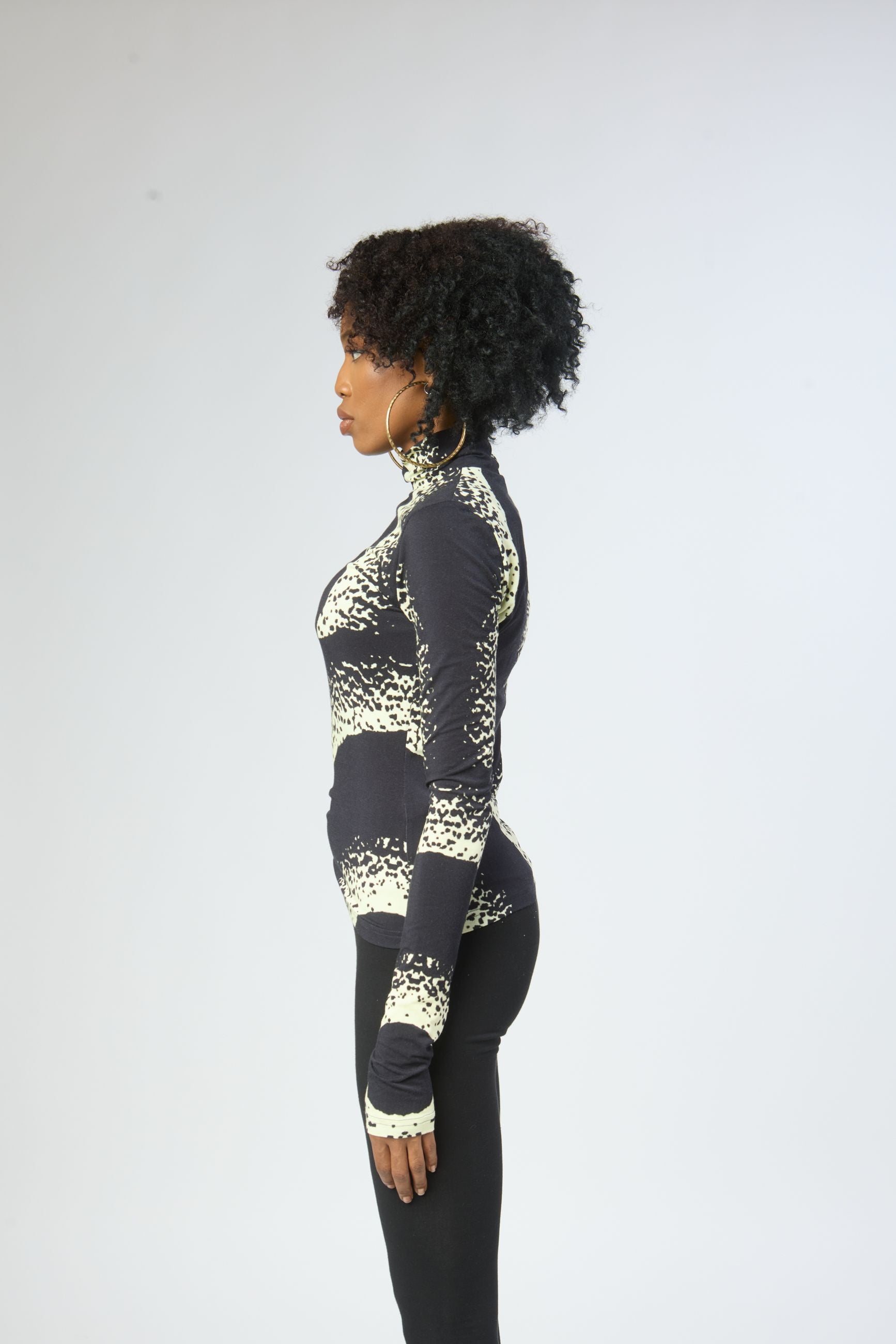 model wearing eco-friendly bold print long sleeve turtleneck