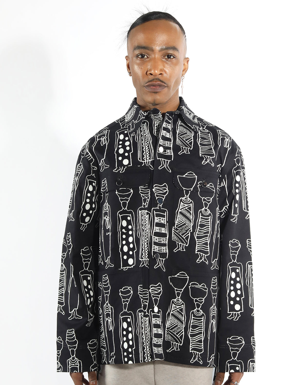 unisex chore coat in organic cotton , featuring a black and white market ladies figure drawing design. relax fit with pratical patch pockets