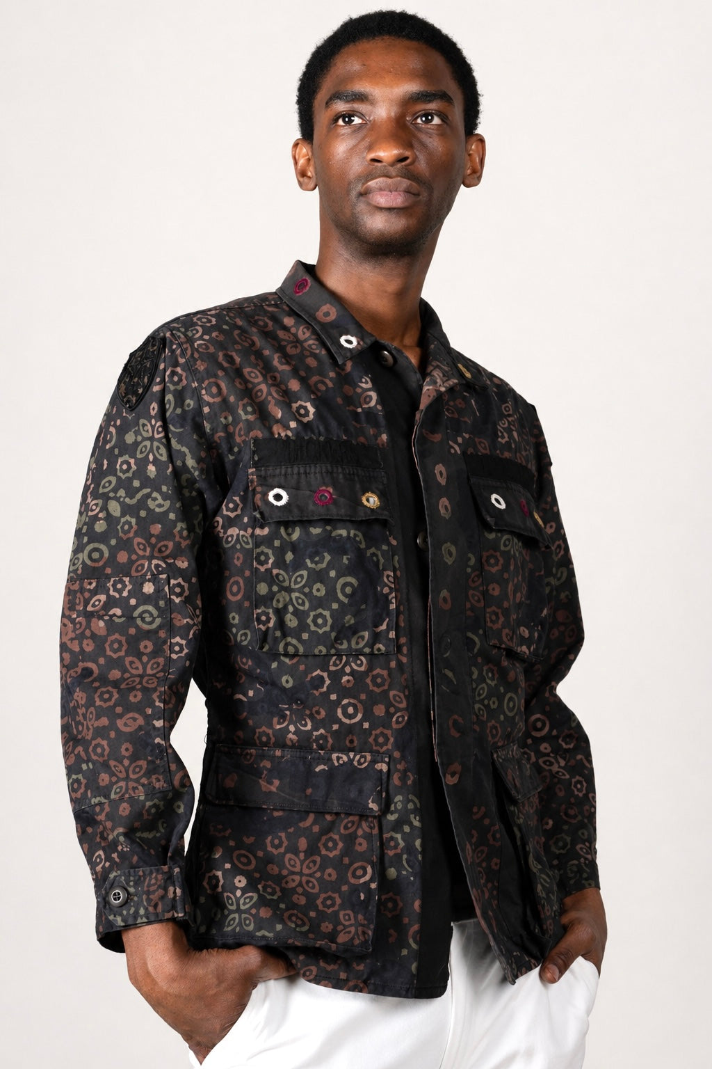 One-of-one vintage army jacket featuring tonal camouflage, natural iron dye process, and artisan mirror embroidery