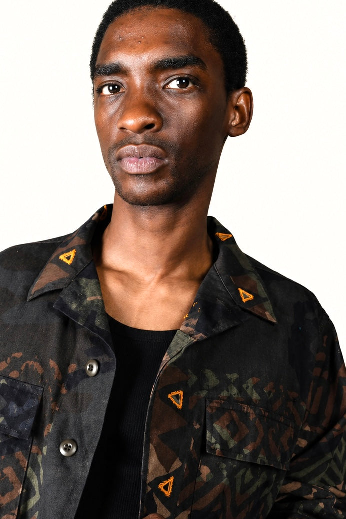 Exclusive reworked military jacket featuring earthy Natural dye (recycled iron + raw sugar), subtle geometric patterning, and artisan mirror embroidery