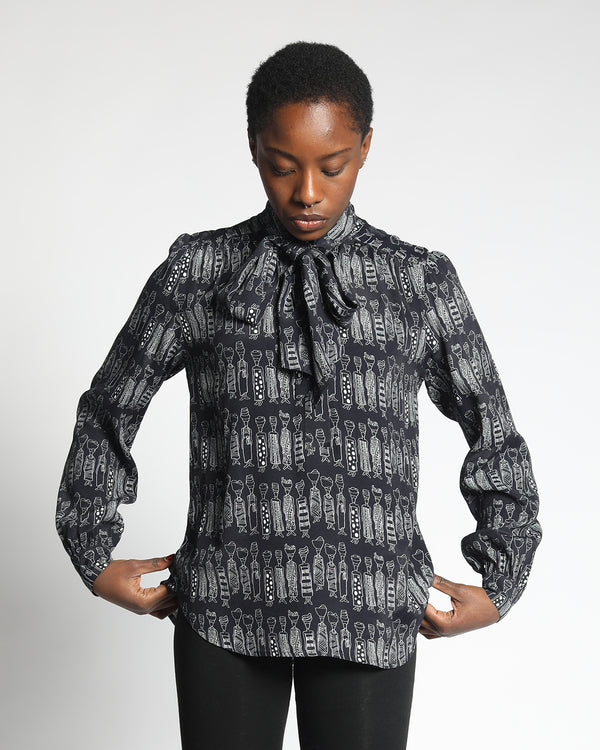 model wearing a elegant stylish  neck tie blouse 