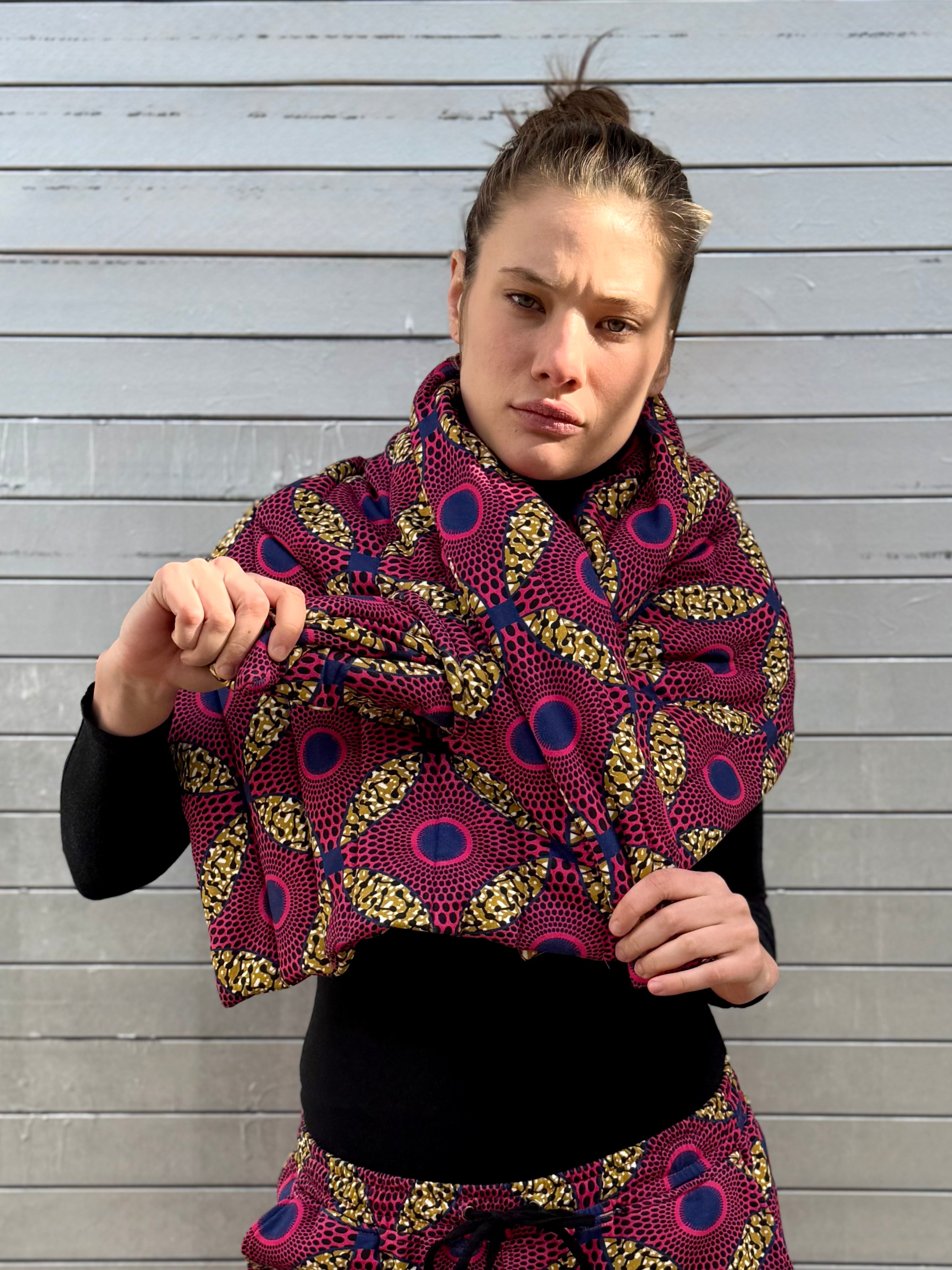 Front portrait of the Ìmọ́lẹ̀ Pink Padded Scarf from Lola Faturoti Loves — a statement of strength, sustainability, and style. Handcrafted in organic cotton with Yoruba textile patterns, it connects heritage and modern confidence through color and conscious design.